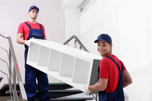 Professional movers preparing boxes and furniture for removal service