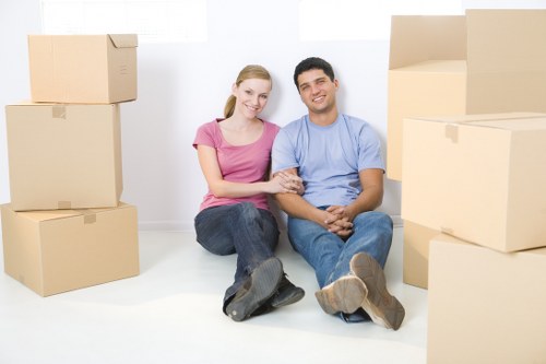 House removal team loading furniture into a moving truck