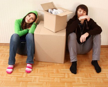 Movers carrying furniture during a home relocation