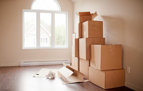 Careful packing of fragile household items for relocation