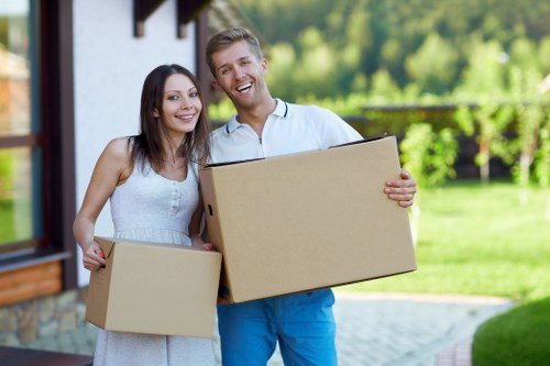 Movers unloading boxes into a new home