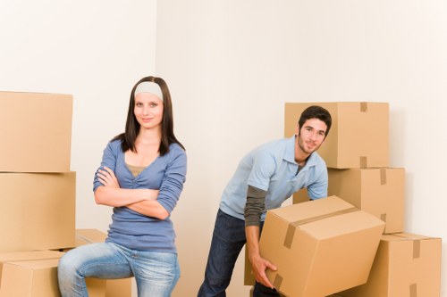 Unpacking service with movers organizing items in a new home