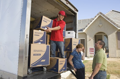 Careful handling of boxes during man with a van move