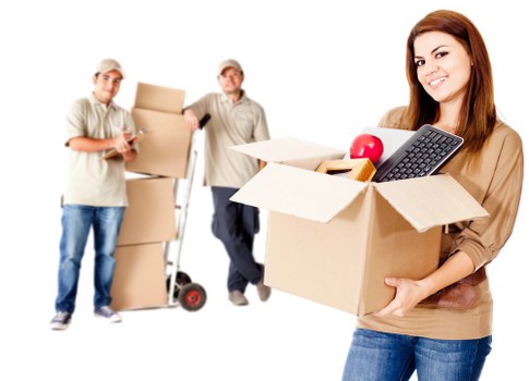 Moving team loading household furniture into a truck