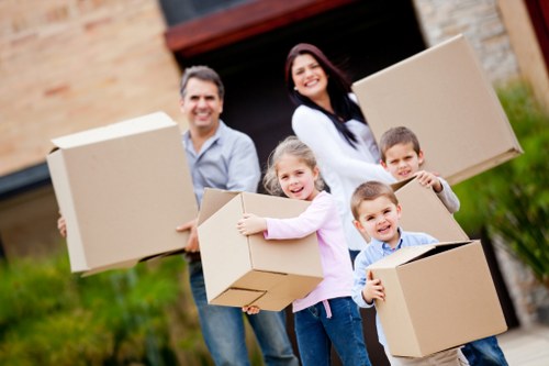 Staff loading furniture carefully as part of a professional insured moving service