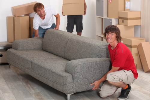 Moving team organizing furniture inside a removal van