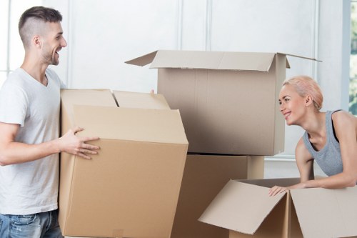Furniture removals team wrapping and protecting items before transport