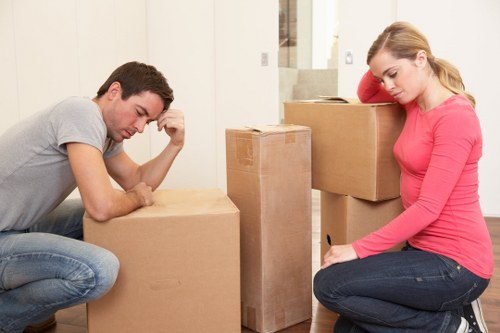 Organized house removals service with labeled boxes and moving supplies