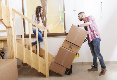 Movers loading furniture and boxes for a flat relocation