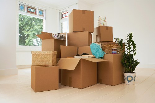 A moving team organizing furniture placement after delivery