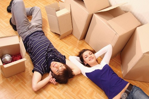 Moving team loading household items into a removal truck