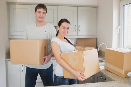 Mover handling furniture transport with care during loading
